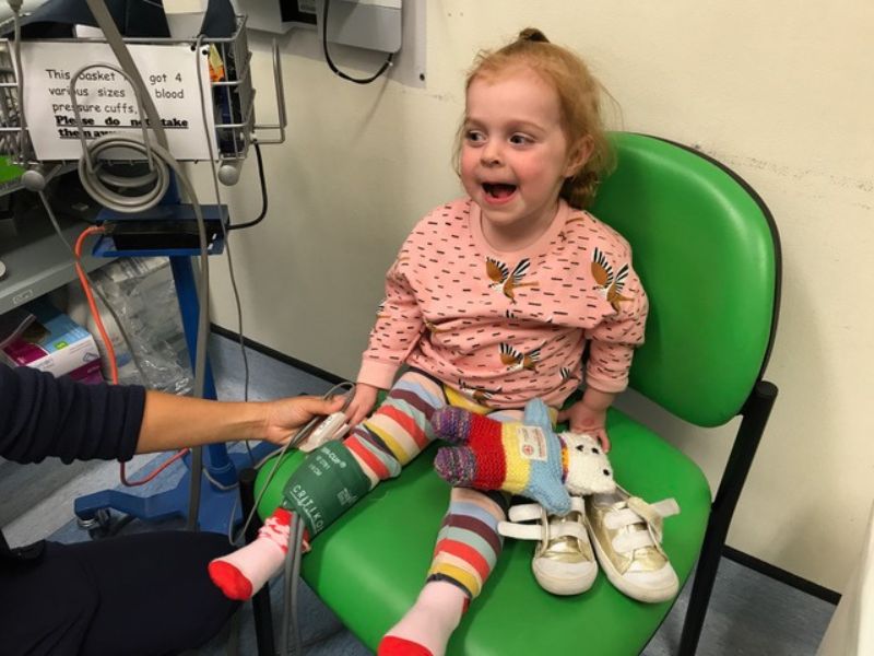 Young girl getting looked after by a nurse