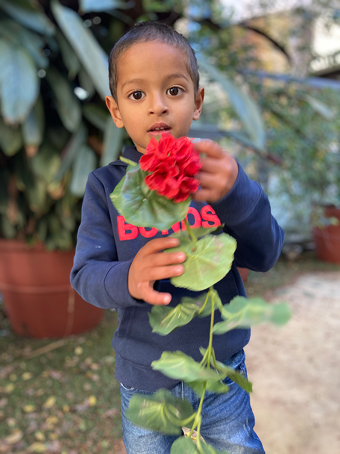 Alen holding a flower