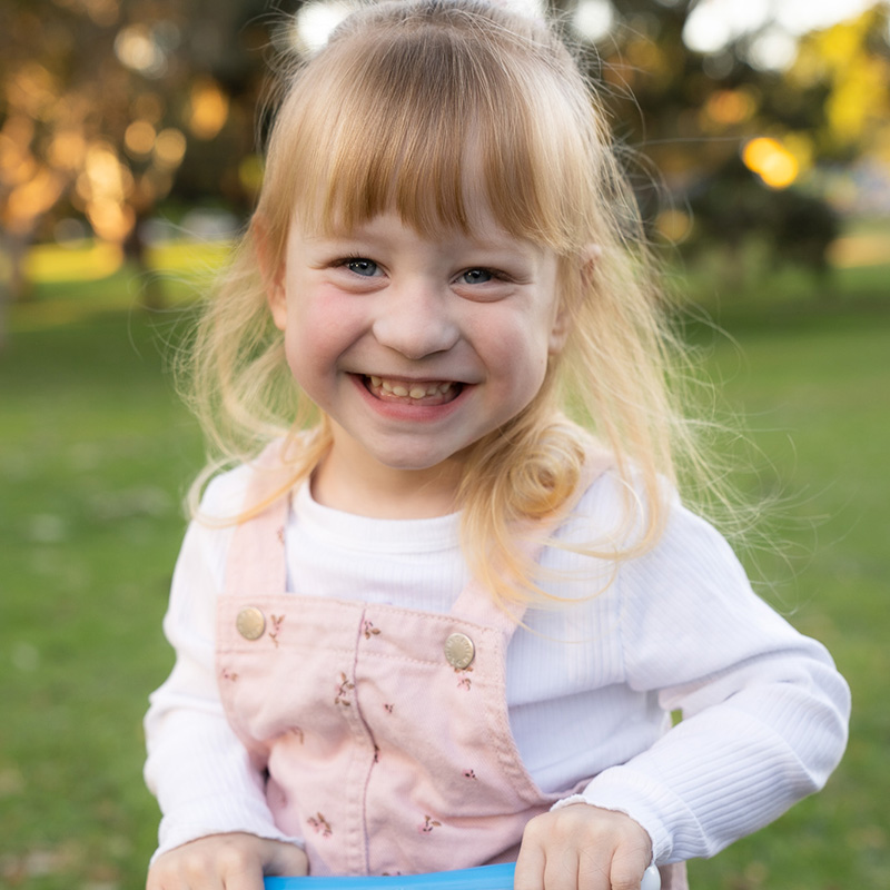 Aria at 3 years old playing outside.