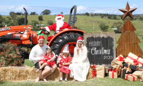 Eleanor's family posing for a Christmas photo with Santa