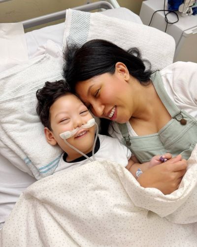 Lucas with Mum in hospital