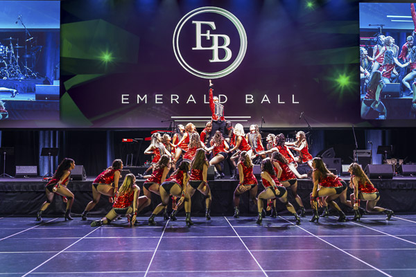 Performers on stage dancing at Emerald Ball 2025