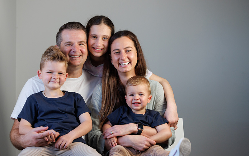 Pictured: Koby and Cooper in a family photo with their parents and older sister