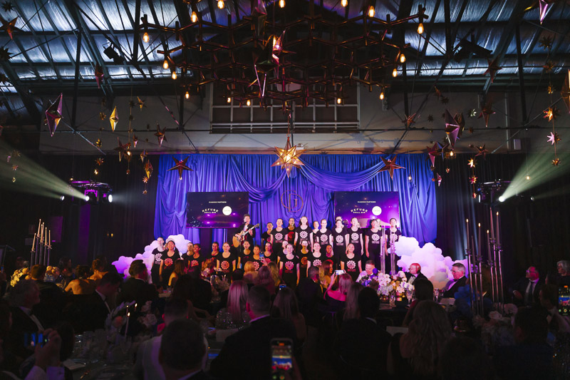 A choir performing on stage at Gold Series - Perth 2025 A choir performing on stage at Gold Series - Perth 2025