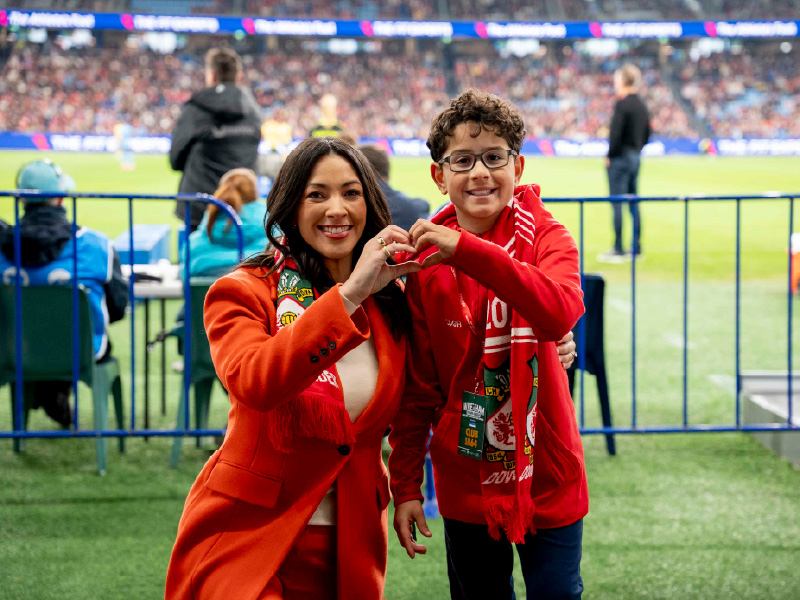 Tara and SCHF patient Nicholas on the sideline at Wrexham vs Sydney FC friendly match
