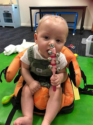 Ryder playing with a shaker toy