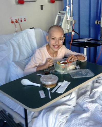 Eve eating in hospital bed
