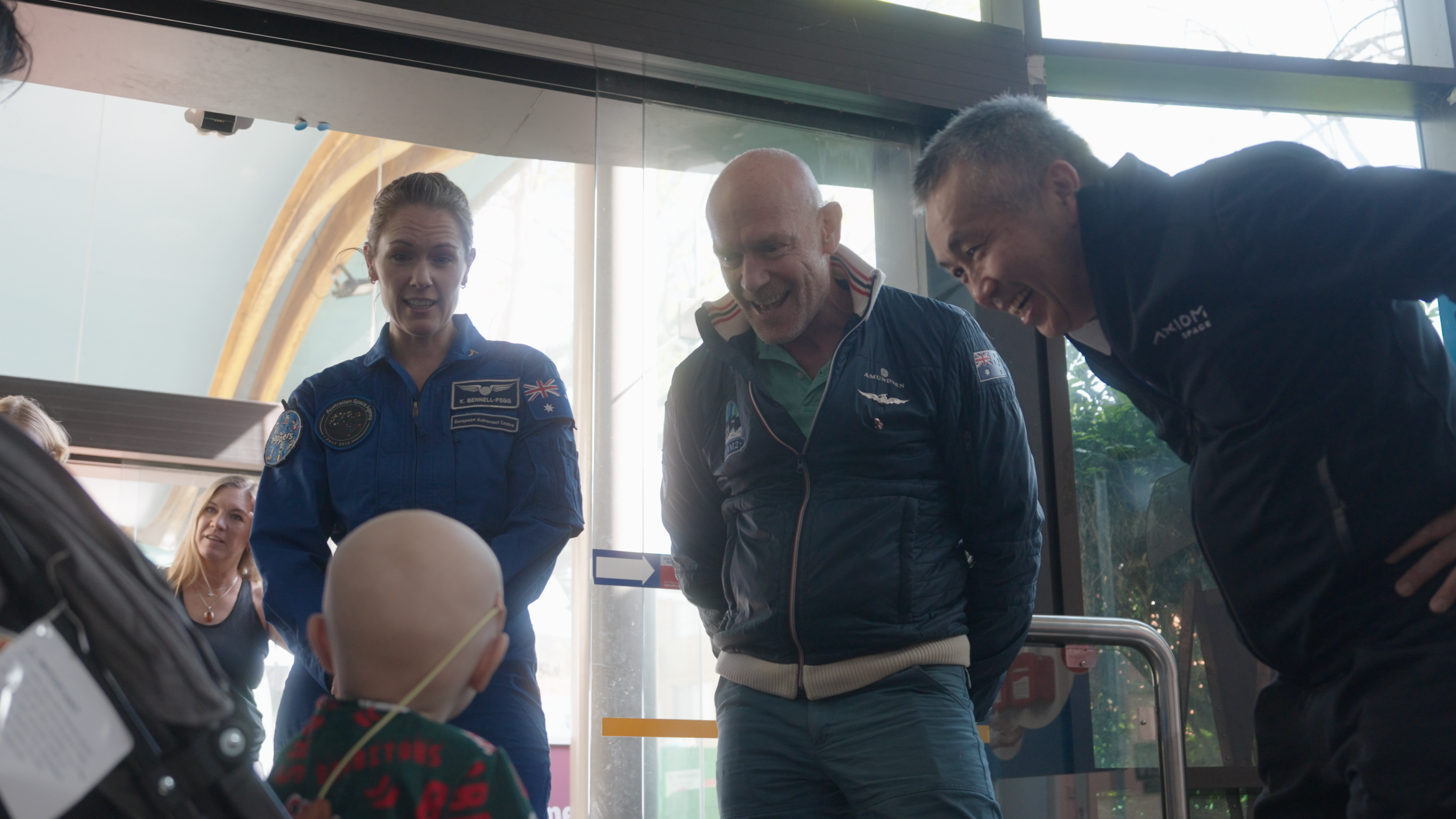 Image of astronauts talking to child. Image of astronauts talking to child.