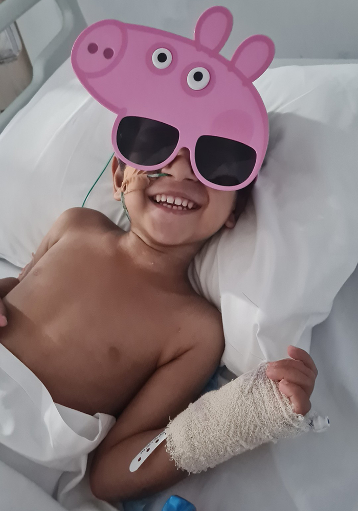 Alen in hospital wearing sunglasses