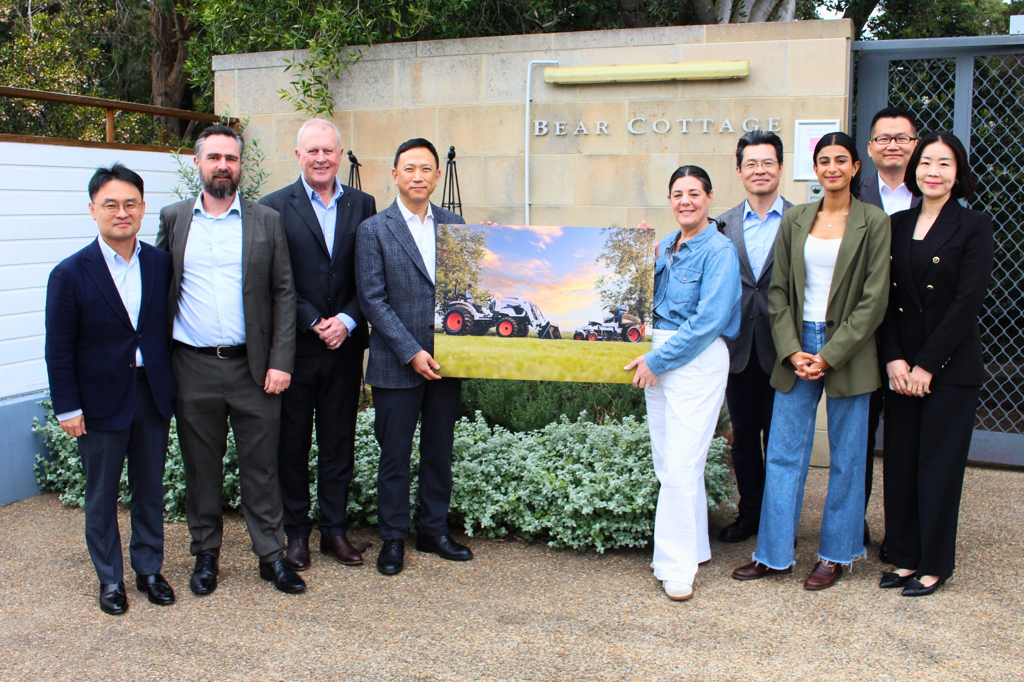 Image of nine people standing outside of Bear Cottage with image of items donated for A Bear Affair.