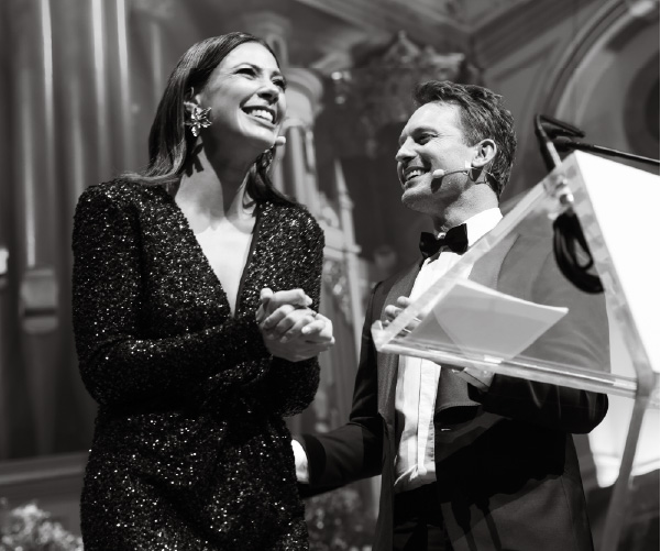 Tara Rushton and Tristan MacManus on stage at Gold Dinner 2023 Tara Rushton and Tristan MacManus on stage at Gold Dinner 2023