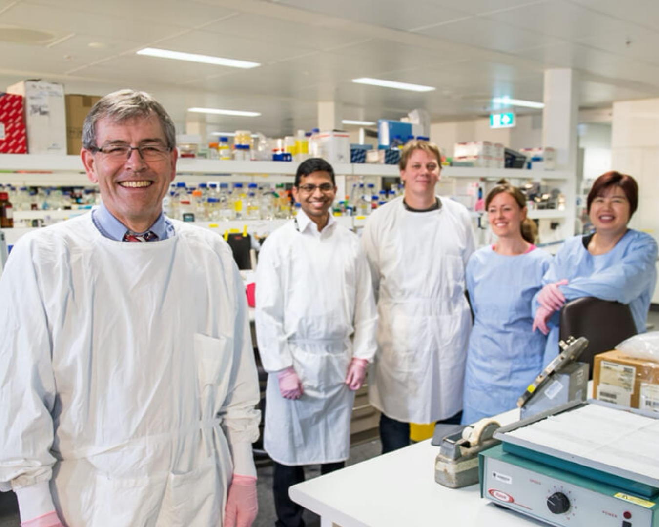 Image of Professor Glenn Marshall in laboratory with researchers.