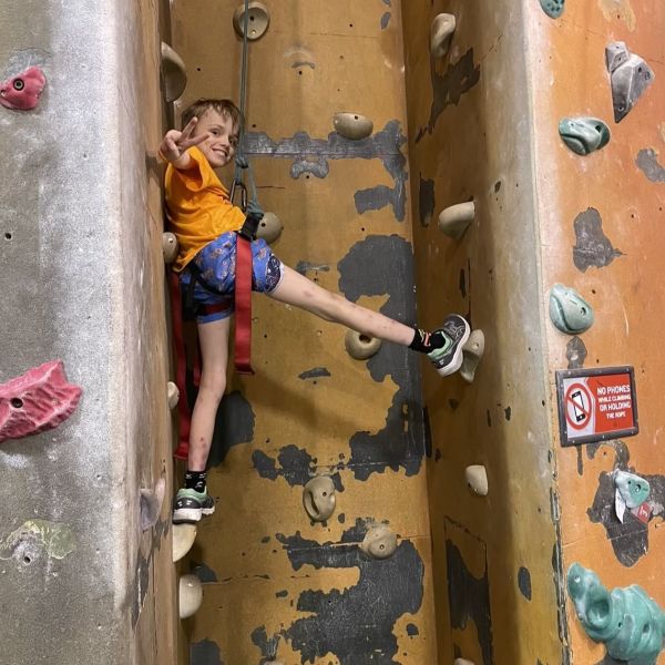 Wiliam at rock climbing