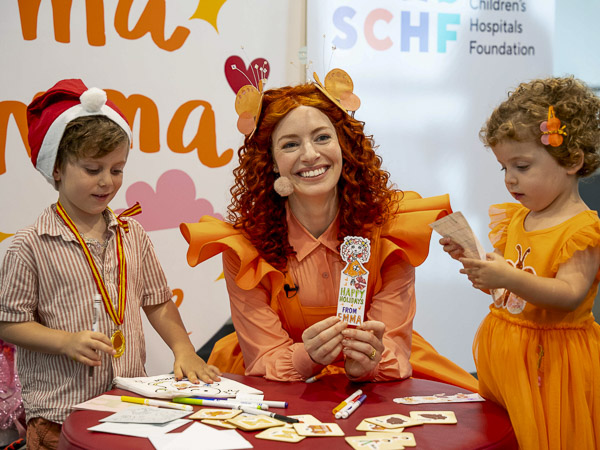 Emma Memma and two children doing arts and crafts