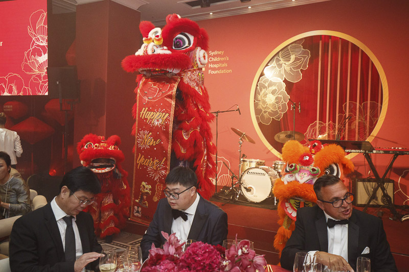 The stage at Lunar New Year Celebration 2025. A Chinese dragon statue stands next to the instruments ready to be played by the band.